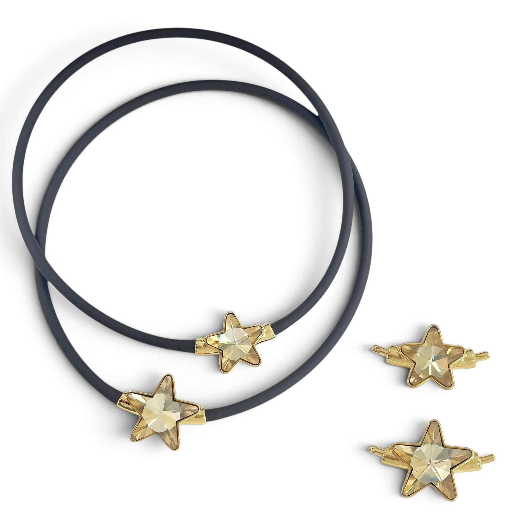 X5 Bijoux black rubber choker necklace featuring a sparkling gold star crystal charm on a white background